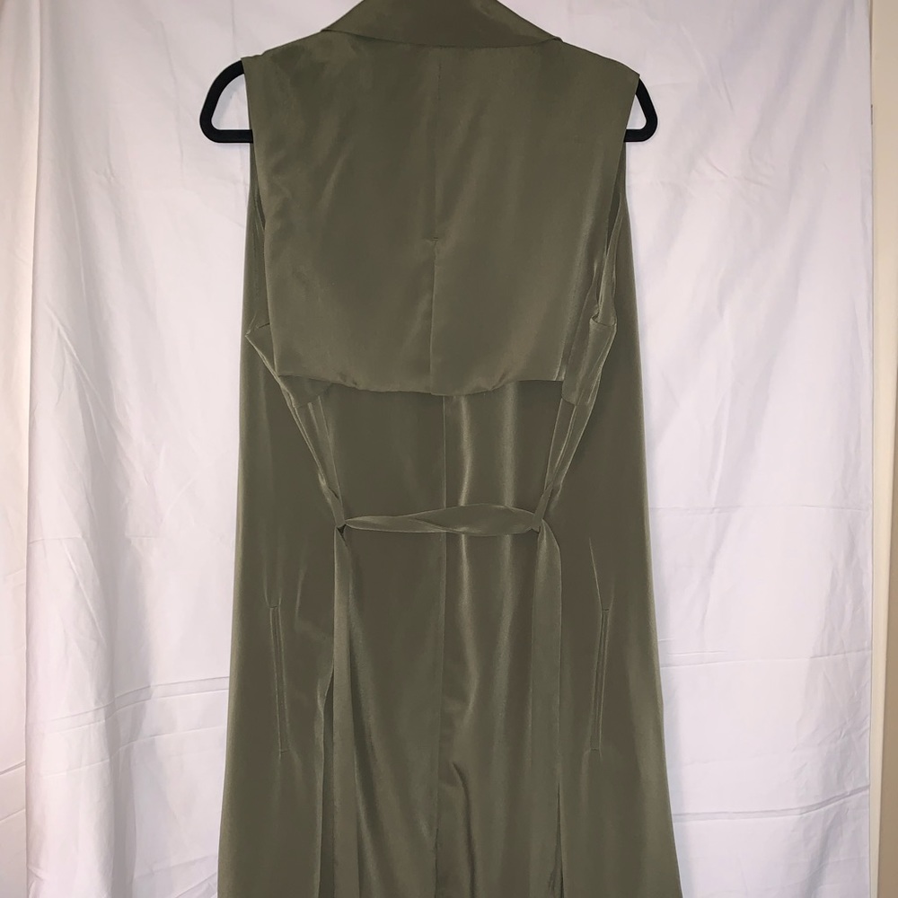 Long vest with belt.